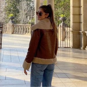 Brown and tan leather jacket lined with sherpa